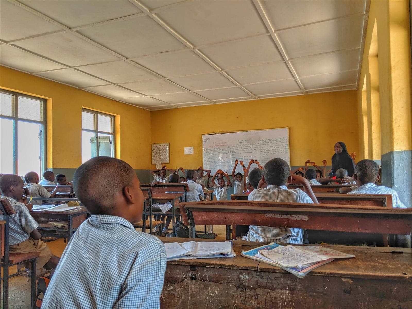 Pupils at their desks in a public school classroom