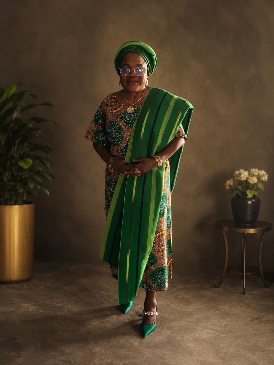 Yeside Ilesanmi standing in green aso-oke with a matching gele