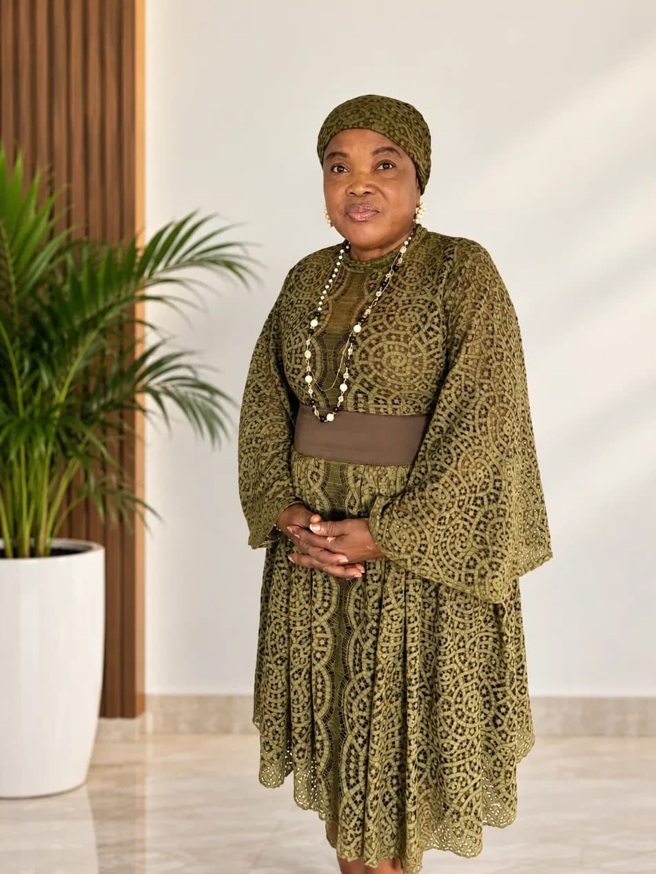Yeside Ilesanmi standing in olive lace, hands clasped